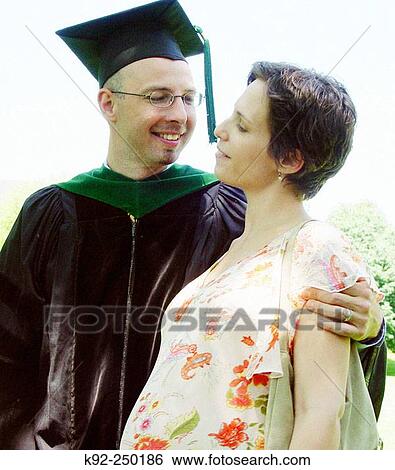 Medical school graduate and his seven month pregnant wife View Large Photo Image Stock Photograph - Medical school graduate and his seven month pregnant wife. Fotosearch