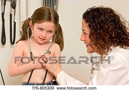 Medical technician or physician / pediatrician playing with a stethoscope during the physical examination of young girl View Large Photo Image Stock Photo - Medical technician or physician / pediatrician playing with a stethoscope during the physical examination of young girl. Fotosearch