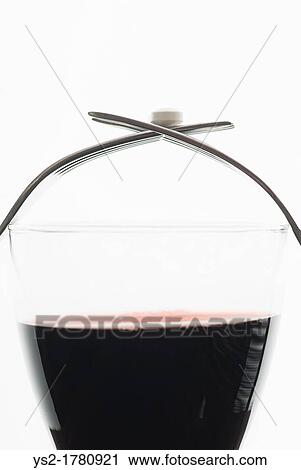 Medicine on top of a glass of red wine View Large Photo Image Stock Image - Medicine on top of a glass of red wine. Fotosearch
