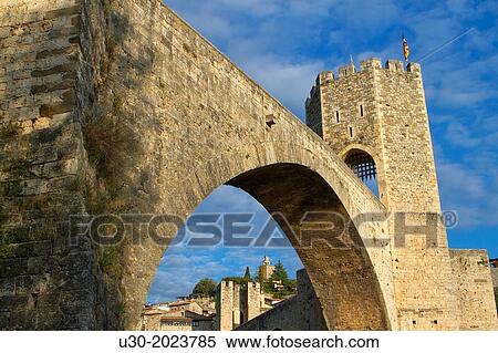 Medieval Bridge (11th Century), in Besalu, a medieval village declarated Historical-Artistic Site, ubicated in La Garrotxa, Girona province. Catalonia; Spain. View Large Photo Image Stock Photography - Medieval Bridge (11th Century), in Besalu, a medieval village declarated Historical-Artistic Site, ubicated in La Garrotxa, Girona province. Catalonia; Spain.. Fotosearch