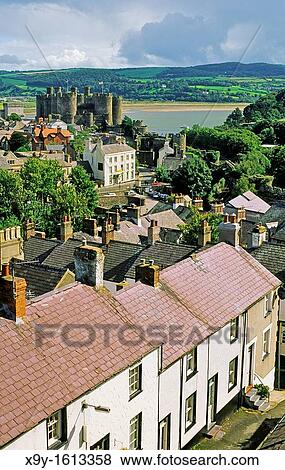 Medieval Conwy Castle, built by King Edward I, Snowdonia, in the Gwynedd region of north Wales Over rooftops from the town wall View Large Photo Image Stock Photo - Medieval Conwy Castle, built by King Edward I, Snowdonia, in the Gwynedd region of north Wales Over rooftops from the town wall. Fotosearch