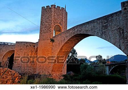 Stock Image - Medieval fortified bridge, river Fluvia, Besalu, Catalonia, Spain. Fotosearch