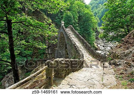 medieval stone bridge ponte romano called roman bridge - near village of corcapolo - centovalli valley - canton of ticino - switzerland View Large Photo Image Stock Image - medieval stone bridge ponte romano called roman bridge - near village of corcapolo - centovalli valley - canton of ticino - switzerland. Fotosearch