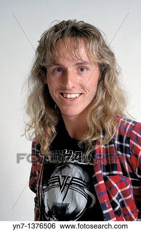 medium close shot of a happy teenage boy with long hair and flannel shirt View Large Photo Image Stock Photograph - medium close shot of a happy teenage boy with long hair and flannel shirt. Fotosearch