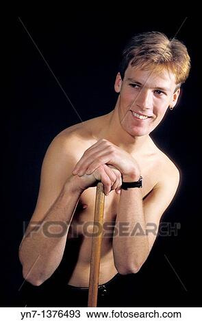 Medium close shot of candsome young cleaner leaning on his broom with his shirt off View Large Photo Image Stock Image - Medium close shot of candsome young cleaner leaning on his broom with his shirt off. Fotosearch