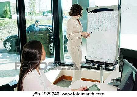 Meeting in an office View Large Photo Image Stock Photograph - Meeting in an office. Fotosearch