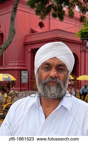 Stock Image - Melaka Malaysia Hertiage City local bearded man Main Square downtown artists area. Fotosearch