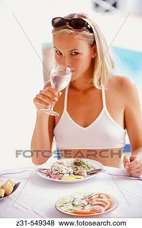 Stock Photo - Melanie, Water Drinking, Fish, Eating. Fotosearch