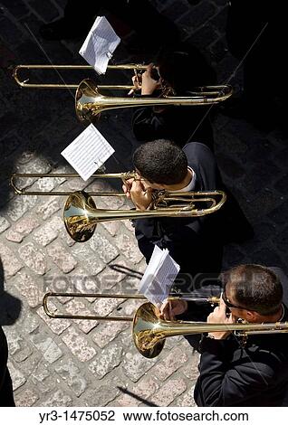 Stock Image - Members of music band performs in an Easter Holy Week procession in Cordoba, Andalusia, Spain, April 17, 2011. Fotosearch