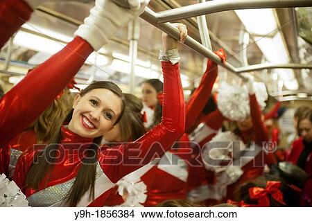 Members of the Varsity Spirit cheerleading team, travel back to their buses via the subway after leading the 86th Annual Macy's Thanksgiving Day parade in New York The team is comprised of elite cheerleaders from around the country View Large Photo Image Picture - Members of the Varsity Spirit cheerleading team, travel back to their buses via the subway after leading the 86th Annual Macy's Thanksgiving Day parade in New York The team is comprised of elite cheerleaders from around the country. Fotosearch