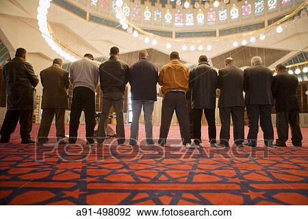 Men at prayer. The King Abdallah mosque also known as Blue Mosque. Amman. Kingdom of Jordan View Large Photo Image Stock Image - Men at prayer. The King Abdallah mosque also known as Blue Mosque. Amman. Kingdom of Jordan. Fotosearch
