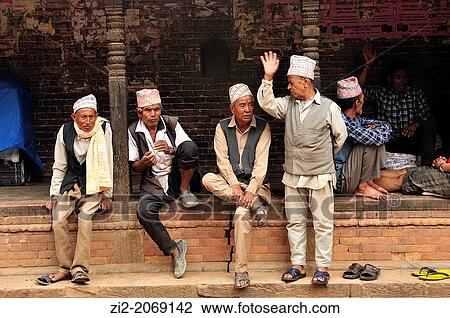 Stock Image - Men chatting, Bhaktapur, Nepal. Fotosearch