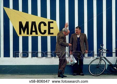 Men chatting in front of a supermarket, Co. Donegal, Ireland View Large Photo Image Stock Photo - Men chatting in front of a supermarket, Co. Donegal, Ireland. Fotosearch