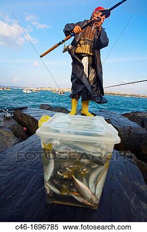 Men fishing on theBosphorus strait Istanbul Turkey. View Large Photo Image Stock Photography - Men fishing on theBosphorus strait Istanbul Turkey.. Fotosearch