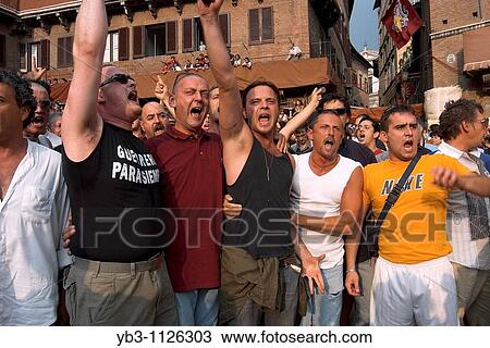 Men from the Torre Contrada sing traditional songs to announce their arrival in the Piazza del Campo, The Palio, Siena, Italy View Large Photo Image Stock Image - Men from the Torre Contrada sing traditional songs to announce their arrival in the Piazza del Campo, The Palio, Siena, Italy. Fotosearch