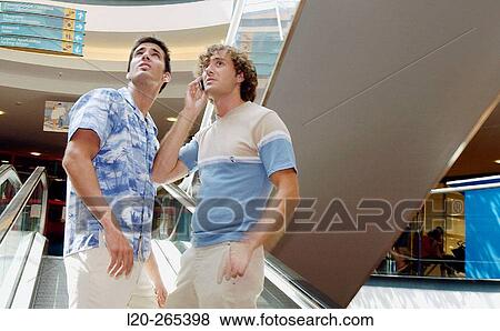 Men in shopping center View Large Photo Image Stock Photo - Men in shopping center. Fotosearch