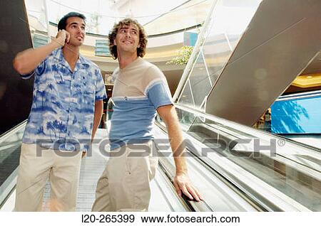 Men in shopping center View Large Photo Image Stock Photo - Men in shopping center. Fotosearch