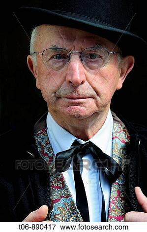 Stock Photo - Men in traditionnal dress of year 1900 Festival of the Norman language in St Peter Port Guernsey, Channel Islands, UK. Fotosearch