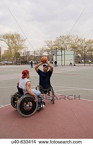 Men in wheelchairs playing basketball View Large Photo Image Picture - Men in wheelchairs playing basketball. Fotosearch