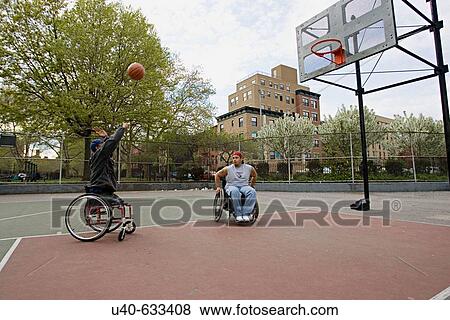 Men in wheelchairs playing basketball View Large Photo Image Stock Photo - Men in wheelchairs playing basketball. Fotosearch