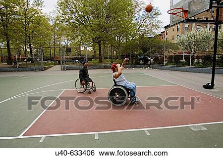 Men in wheelchairs playing basketball View Large Photo Image Stock Photograph - Men in wheelchairs playing basketball. Fotosearch