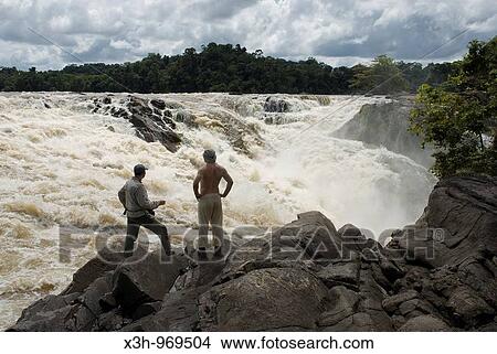 men looking at Para falls on Caura river, state of Bolivar, Bolivarian Republic of Venezuela, South America View Large Photo Image Picture - men looking at Para falls on Caura river, state of Bolivar, Bolivarian Republic of Venezuela, South America. Fotosearch