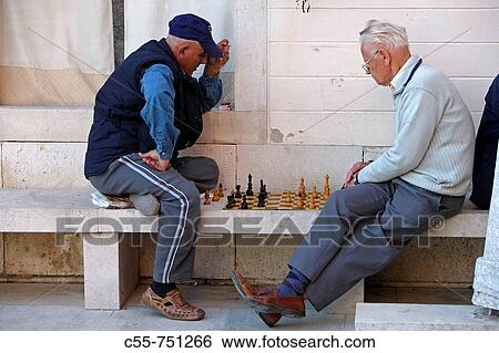 Men playing chess, Piran, Slovenia View Large Photo Image Stock Photograph - Men playing chess, Piran, Slovenia. Fotosearch