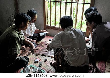 Stock Photo - men playing game of strategy, Northern Vietnam, southeast asia. Fotosearch