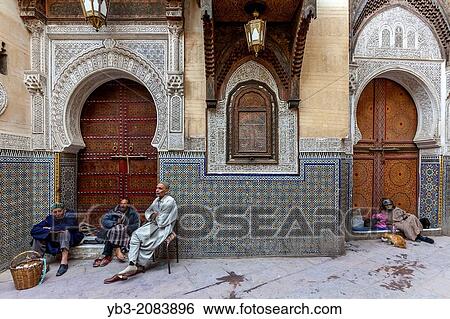 Men sitting outside Mosque Sidi Ahmed Tijani, The Medina, Fez, Morocco. View Large Photo Image Stock Photograph - Men sitting outside Mosque Sidi Ahmed Tijani, The Medina, Fez, Morocco.. Fotosearch
