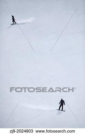 Men skiing in a resort. View Large Photo Image Stock Image - Men skiing in a resort.. Fotosearch
