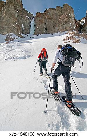 Men snowshoeing to go ice climbing near Silver Creek in the Boulder Mountains in central Idaho View Large Photo Image Stock Photo - Men snowshoeing to go ice climbing near Silver Creek in the Boulder Mountains in central Idaho. Fotosearch