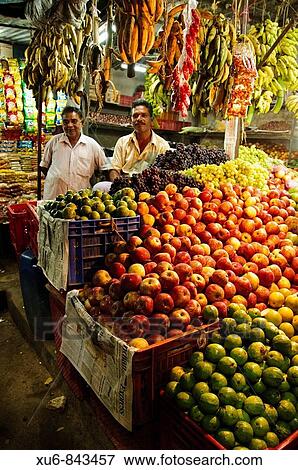 Men standing in their fresh produce shop Alleppy, Kerala, India View Large Photo Image Stock Photo - Men standing in their fresh produce shop Alleppy, Kerala, India. Fotosearch