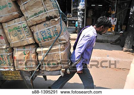 Men transport heavy luggages by man power View Large Photo Image Stock Image - Men transport heavy luggages by man power. Fotosearch