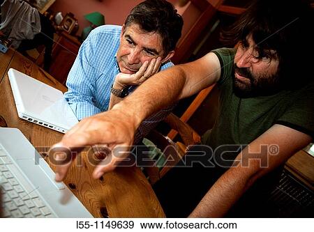 Men using computer View Large Photo Image Stock Photo - Men using computer. Fotosearch