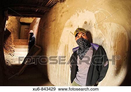 Men wearing masks to protect from the dust of working in a passage at tiksey monastery Tiksey, Ladakh, India View Large Photo Image Stock Photo - Men wearing masks to protect from the dust of working in a passage at tiksey monastery Tiksey, Ladakh, India. Fotosearch