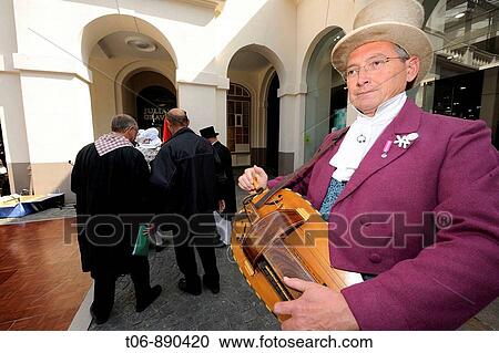 Men who play medieval vielle in traditionnal dress of year 1900 Festival of the Norman language in St Peter Port Guernsey, Channel Islands, UK View Large Photo Image Stock Image - Men who play medieval vielle in traditionnal dress of year 1900 Festival of the Norman language in St Peter Port Guernsey, Channel Islands, UK. Fotosearch