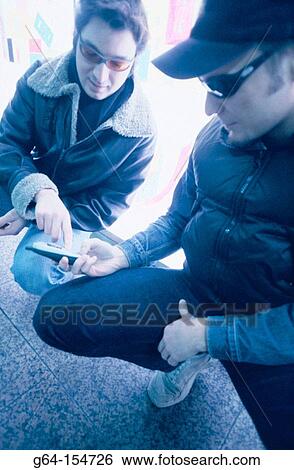 Men with cell phone View Large Photo Image Stock Photograph - Men with cell phone. Fotosearch