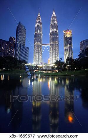 Menara Petronas towers at night, Kuala Lumpur, Malaysia View Large Photo Image Stock Photo - Menara Petronas towers at night, Kuala Lumpur, Malaysia. Fotosearch