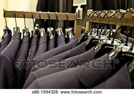 Men's Suits Displayed on a Rack in a Clothing Store View Large Photo Image Stock Photo - Men's Suits Displayed on a Rack in a Clothing Store. Fotosearch