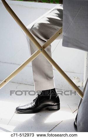 Men's trouser leg under iron board View Large Photo Image Stock Image - Men's trouser leg under iron board. Fotosearch
