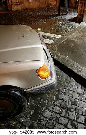Stock Photography - mercedes bmw type car in trastevere area at night rome italy. Fotosearch