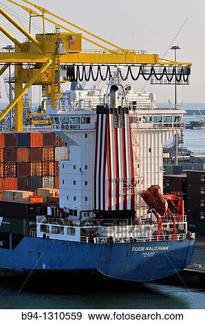 Stock Photo - Merchant ship at port, Livorno, Liguria, Italy. Fotosearch