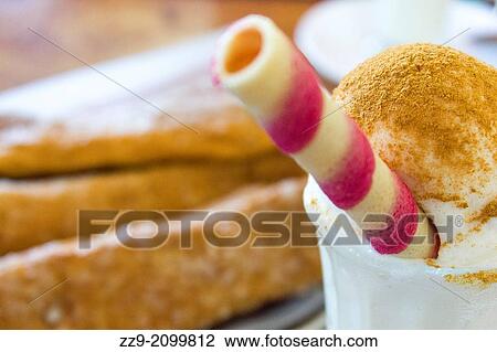 Stock Image - meringue icre cream with cinnamon.. Fotosearch
