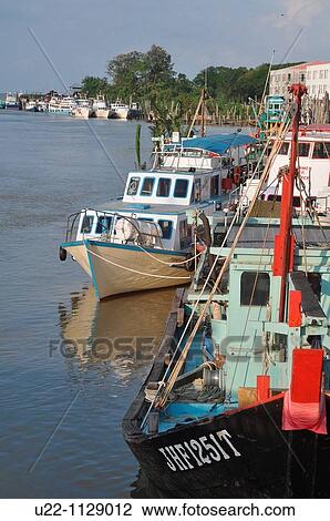 Mersing (Malaysia): fishing boats along the Suungal Mersing canal View Large Photo Image Stock Image - Mersing (Malaysia): fishing boats along the Suungal Mersing canal. Fotosearch
