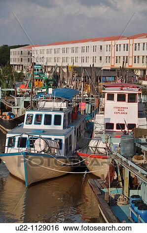 Mersing (Malaysia): fishing boats along the Suungal Mersing canal View Large Photo Image Stock Photograph - Mersing (Malaysia): fishing boats along the Suungal Mersing canal. Fotosearch