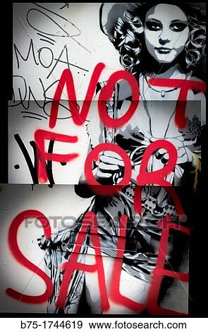 Stock Photo - Message Not For Sale, written on a wall by hand on top of a female stencil drawing. Fotosearch