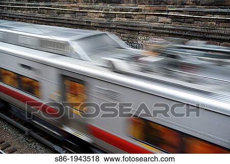 Metro North Commuter Train Speeding Along in an Underpass, New York, Manhattan, NY, USA. View Large Photo Image Stock Photo - Metro North Commuter Train Speeding Along in an Underpass, New York, Manhattan, NY, USA.. Fotosearch