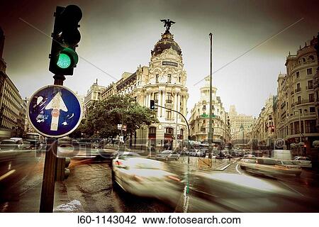 Stock Image - Metropolis building and Grassy building, romantic view Gran V? a street, Madrid, Spain. Fotosearch