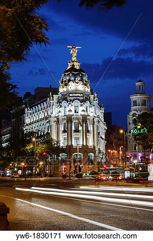 Stock Image - Metropolis Building at Dusk, Gran Via, Madrid, Spain. Fotosearch