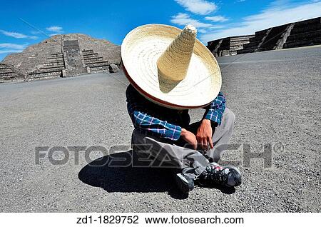Stock Image - Mexican man having a siesta near the San Juan Teotihuacan pyramids. Fotosearch